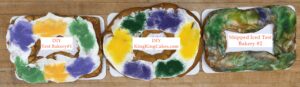 Three finished shipped king cakes displayed side by side for a size and value comparison.